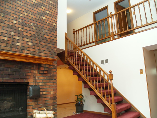 457 Rockhurst Road Bolingbrook, IL 60440 - Photo 8 of 24 a view of staircase with railing and white walls