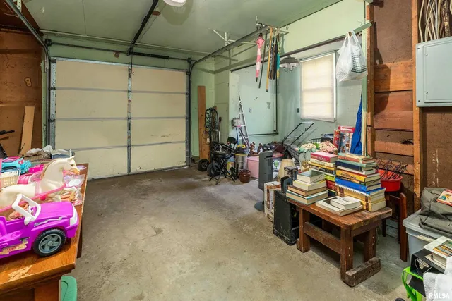 an aerial view of a house with a yard and trees