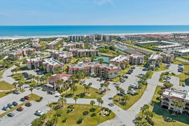 an aerial view of residential building and ocean