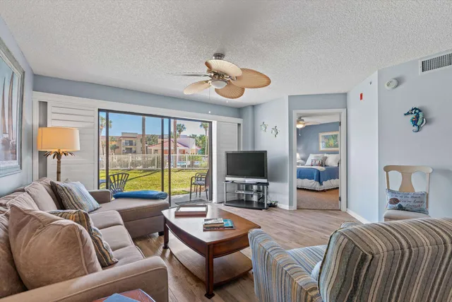 a bedroom with a balcony a bed and a couch