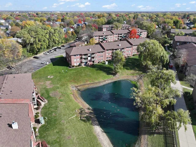 a front view of a house with a garden and deck