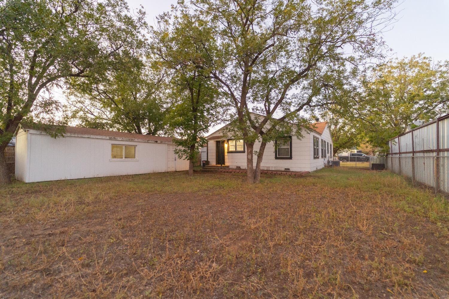 1517 41st Street Lubbock, TX 79412 - Photo 19 of 22 a view of a house with a yard