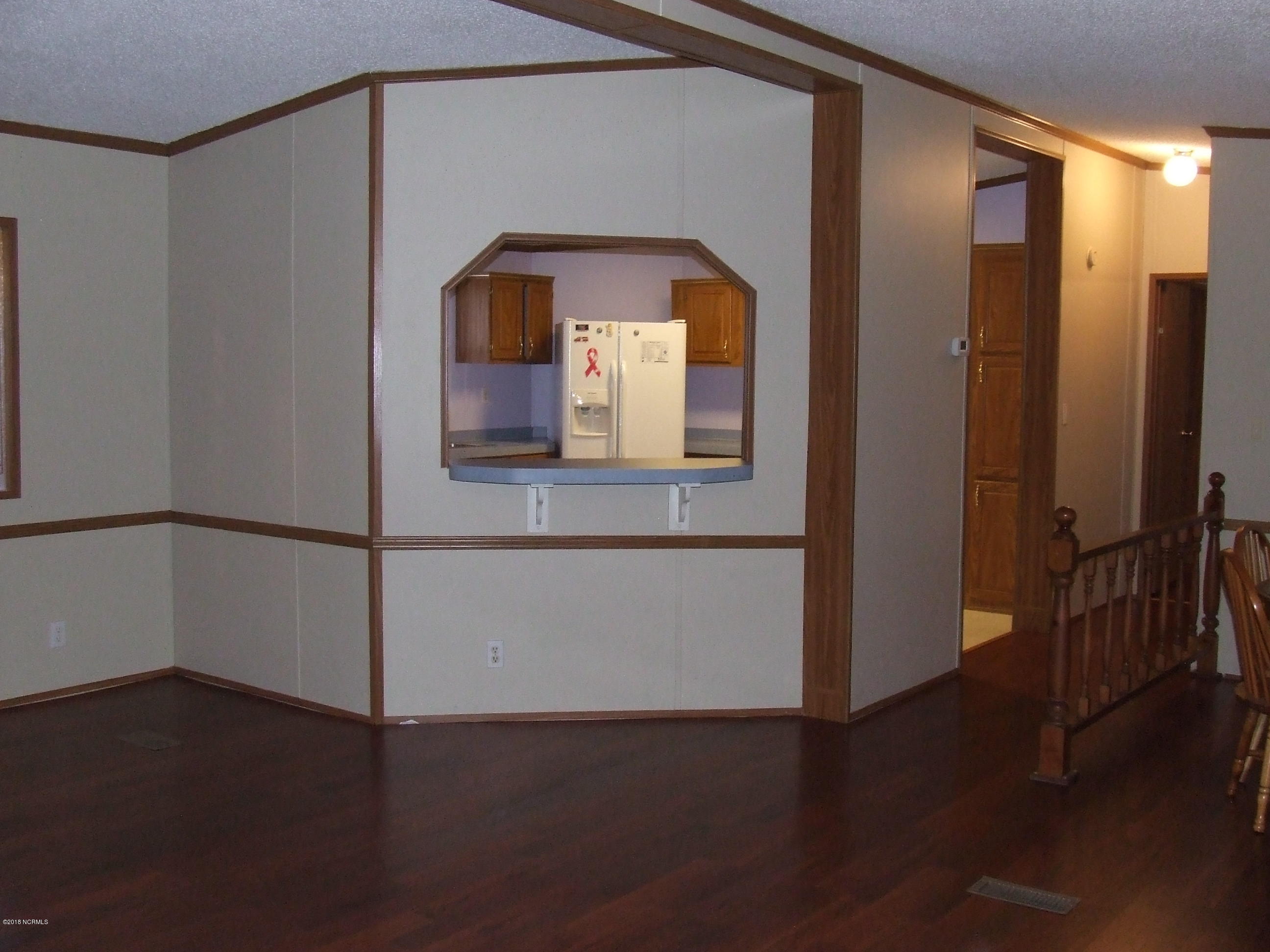 4714 Port Loop Road Southeast Southport, NC 28461 - Photo 15 of 39 VIEW TO THE KITCHEN WITH BAR AREA