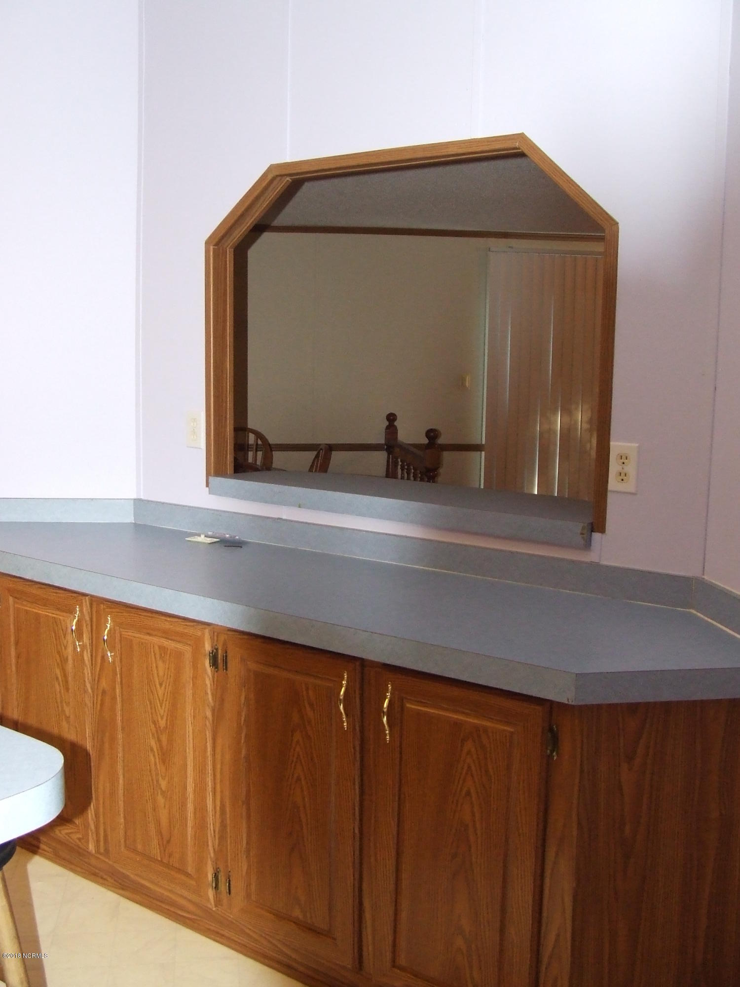 4714 Port Loop Road Southeast Southport, NC 28461 - Photo 22 of 39 SIDEBAR HUTCH IN KITCHEN