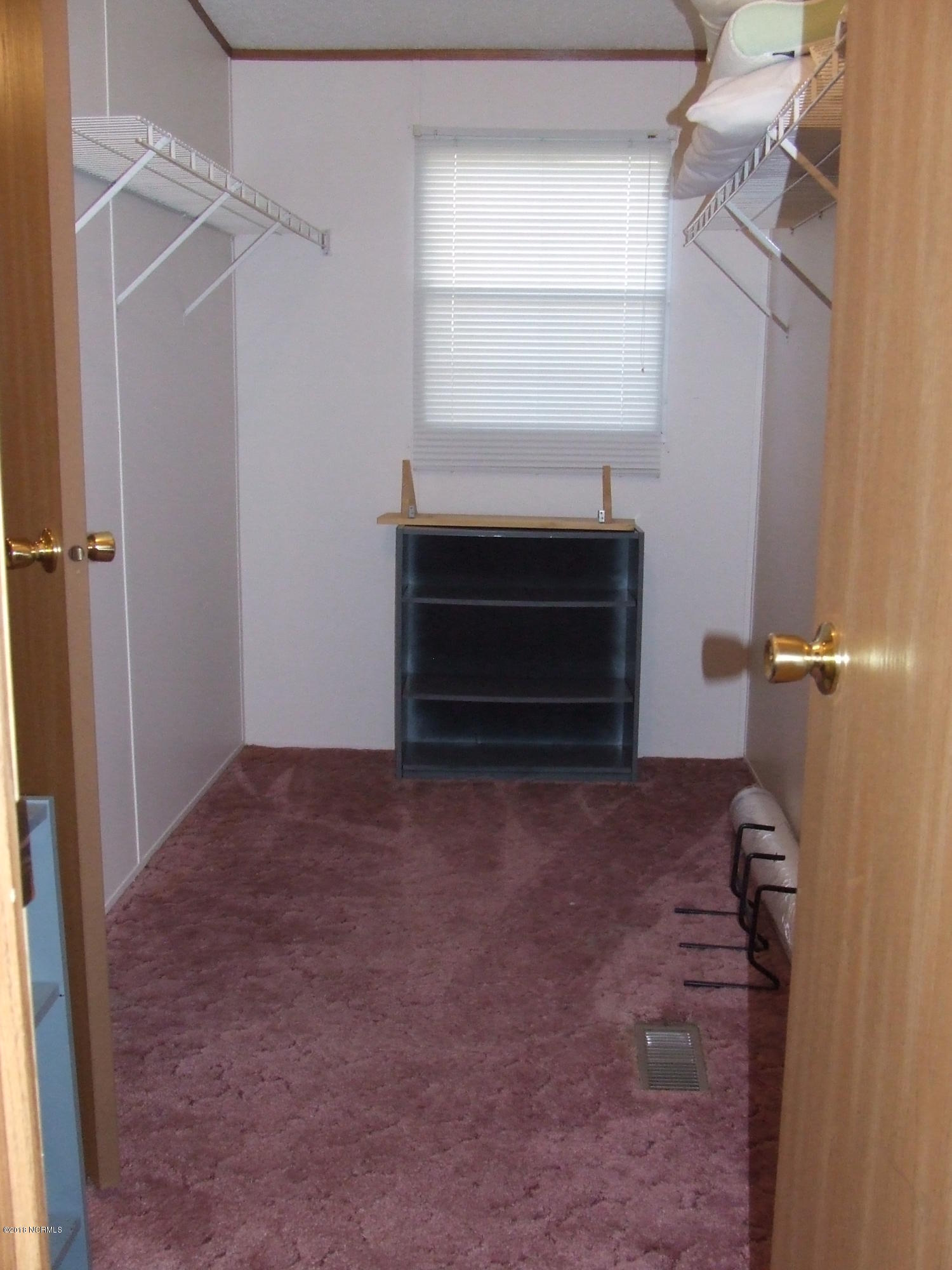 4714 Port Loop Road Southeast Southport, NC 28461 - Photo 26 of 39 MASTER BEDROOM WALK IN CLOSET