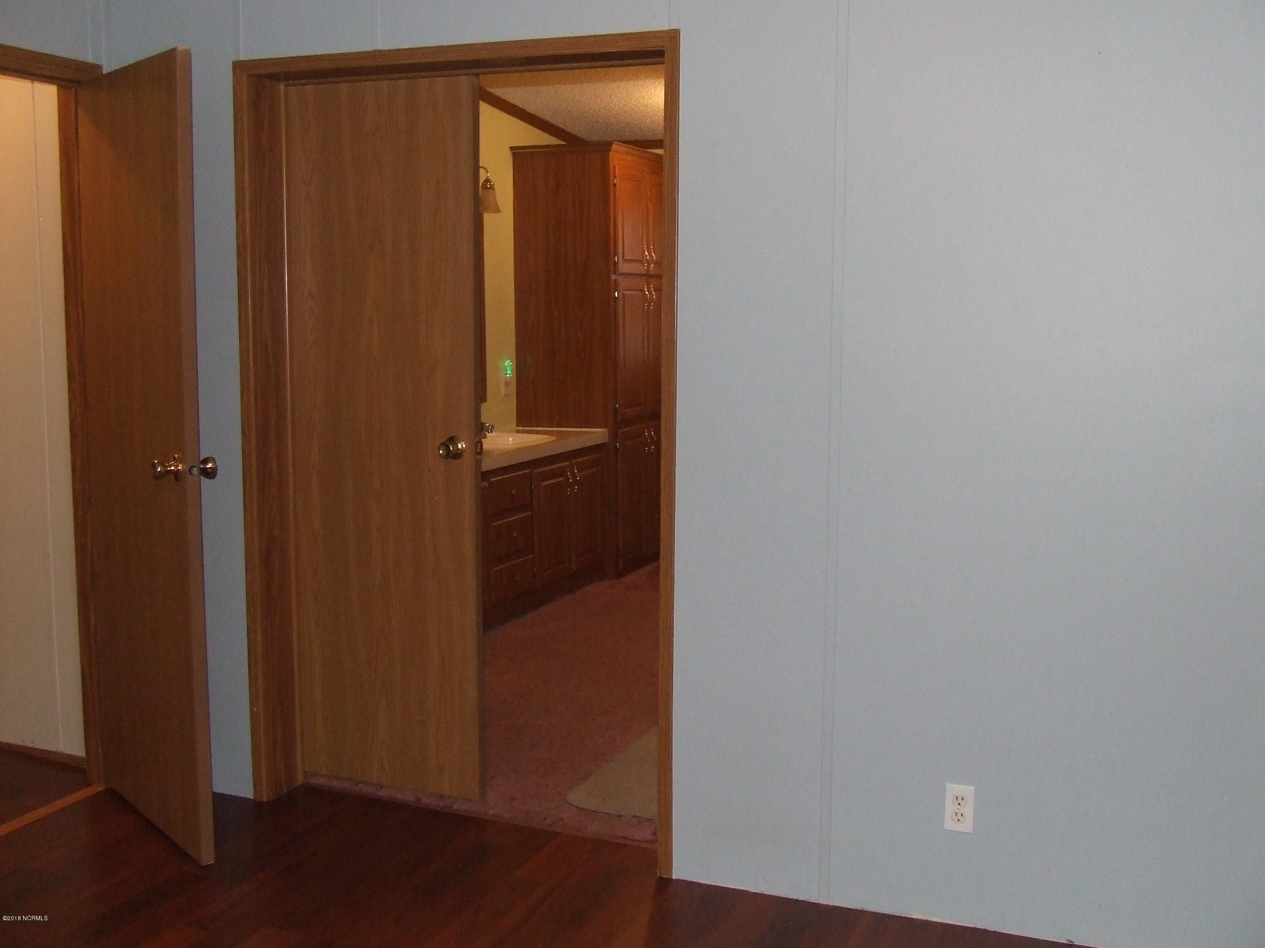 4714 Port Loop Road Southeast Southport, NC 28461 - Photo 27 of 39 DOORWAY TO MASTER BATH