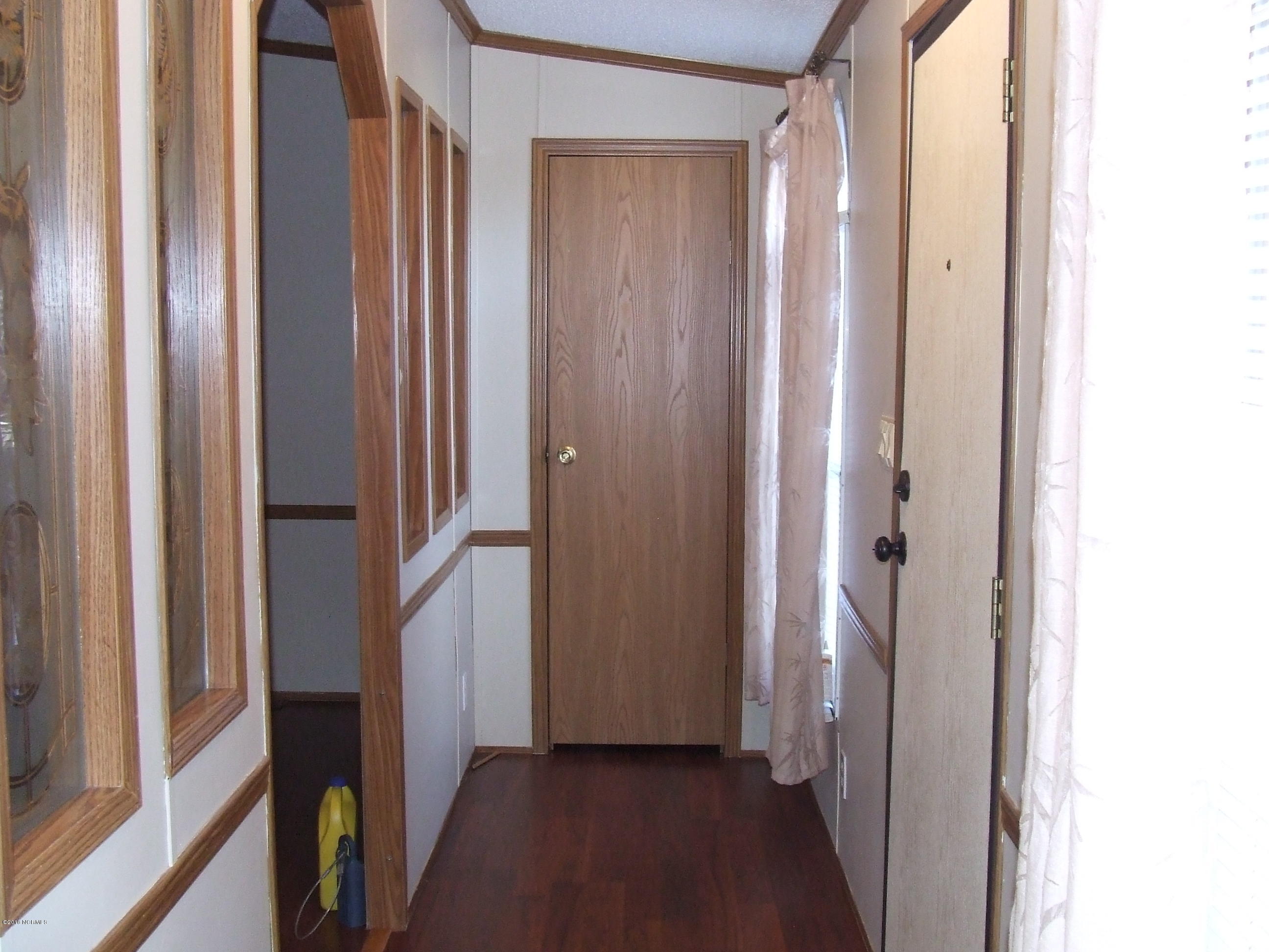 4714 Port Loop Road Southeast Southport, NC 28461 - Photo 9 of 39 FRONT HALL WITH COAT CLOSET
