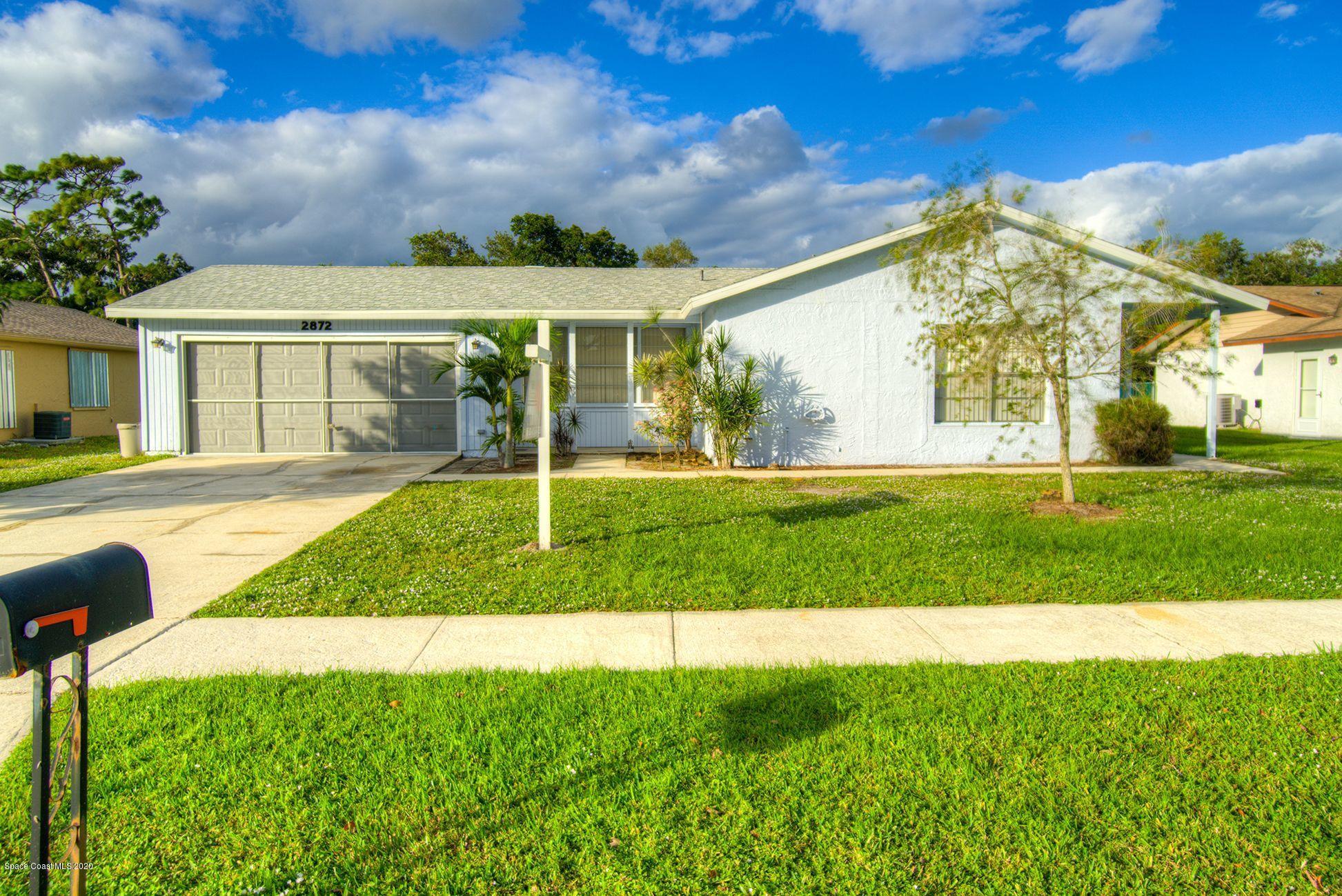 2872 Pembroke Road Melbourne, FL 32935 - Photo 1 of 32 a view of a house with a big yard
