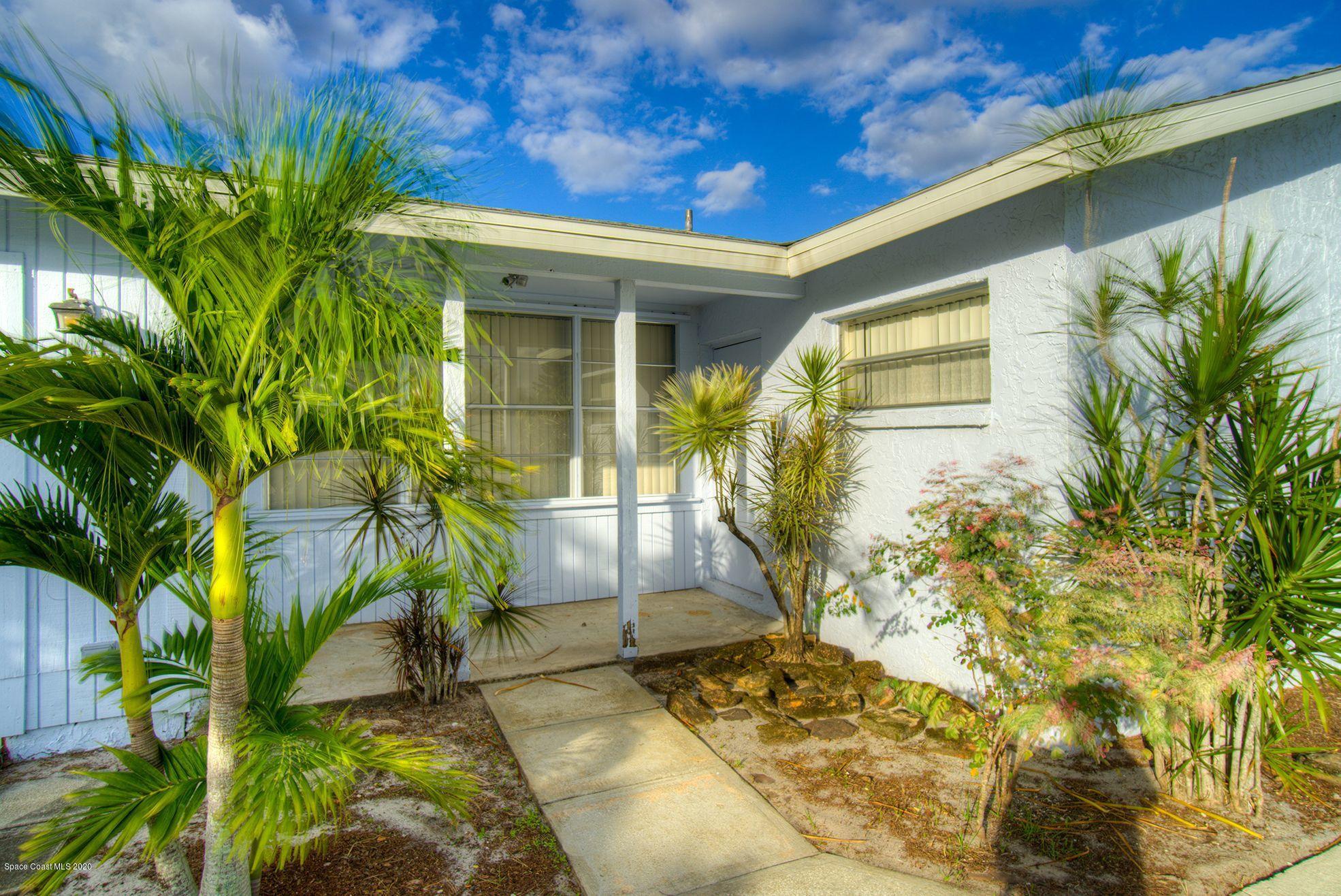 2872 Pembroke Road Melbourne, FL 32935 - Photo 2 of 32 a front view of a house with a yard
