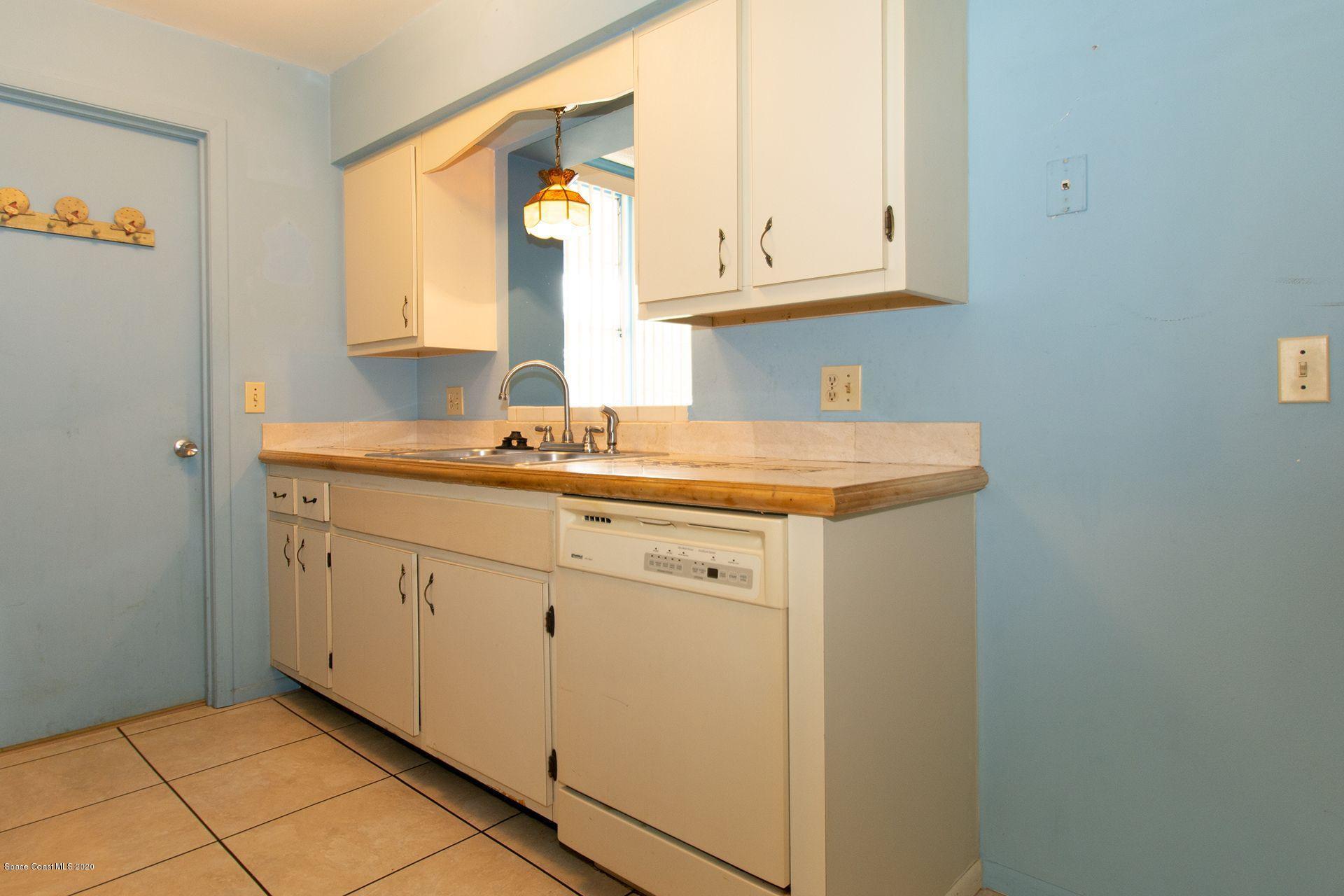 2872 Pembroke Road Melbourne, FL 32935 - Photo 11 of 32 a utility room with a sink washer and dryer