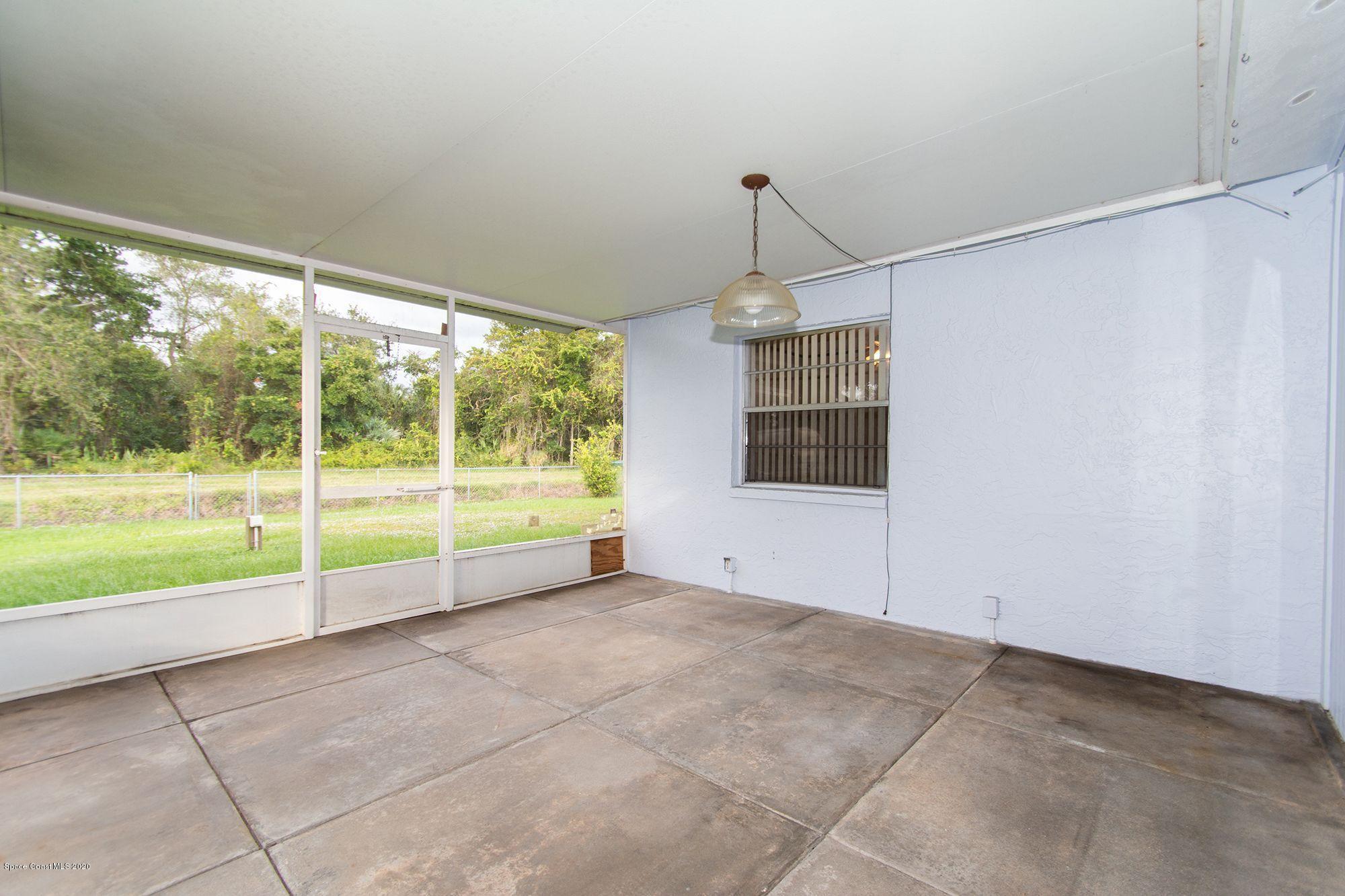 2872 Pembroke Road Melbourne, FL 32935 - Photo 19 of 32 a view of an empty room with windows
