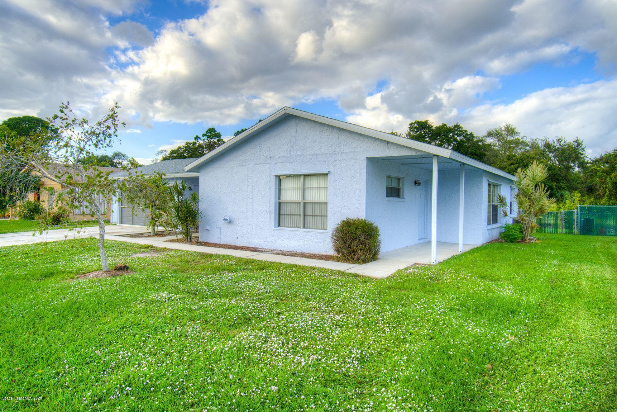 2872 Pembroke Road Melbourne, FL 32935 - Photo 3 of 32 a view of a house with backyard and garden