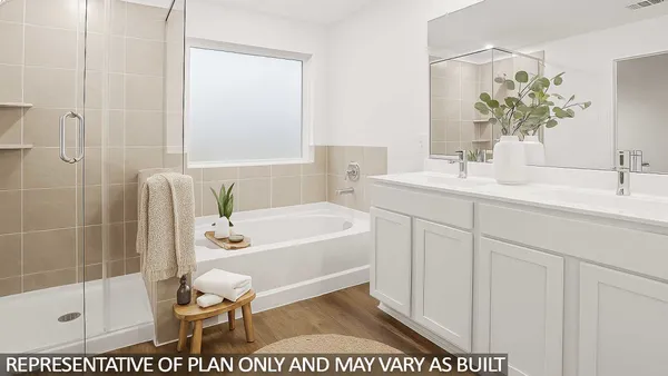 a bathroom with a sink a toilet a mirror a bathtub and shower