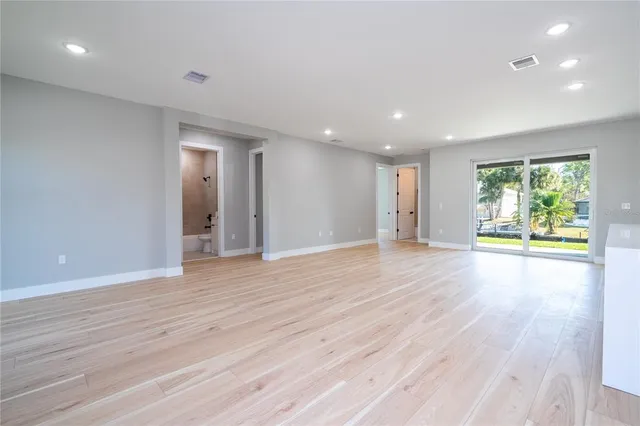 a living room with a flat screen tv and furniture