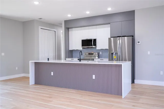 a view of kitchen and microwave