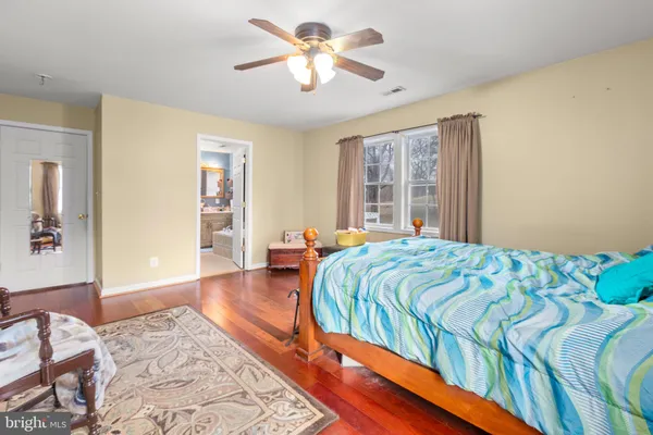 a bedroom with a bed and balcony view