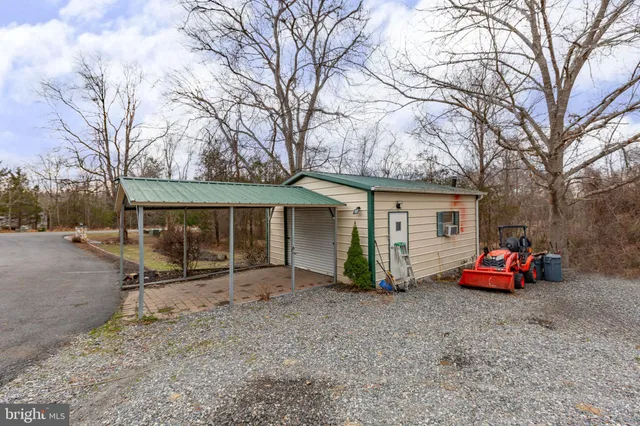 a view of a car park in front of house