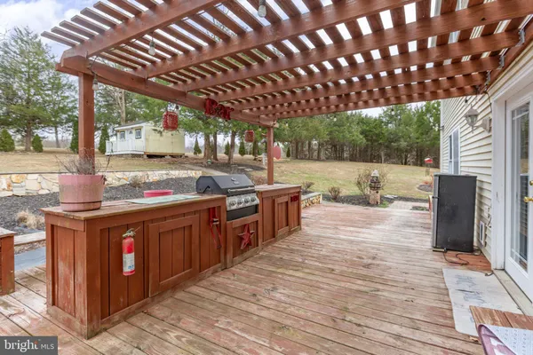 a kitchen with stainless steel appliances granite countertop a stove a sink and a wooden floors