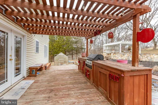 a living room with a large window and furniture