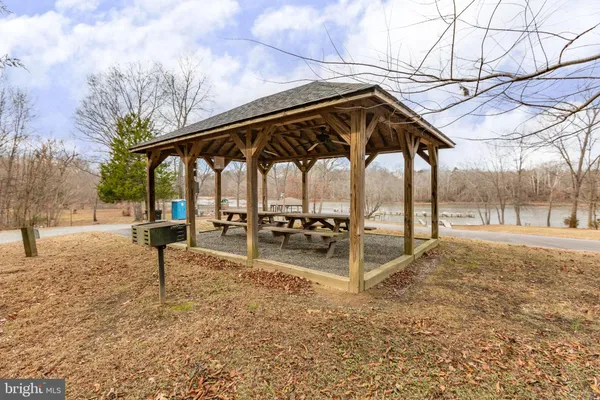 a view of a park with iron fence