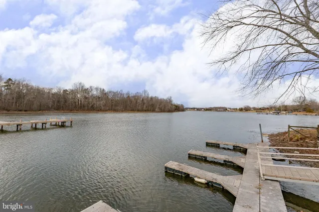 a view of a lake with houses in the back