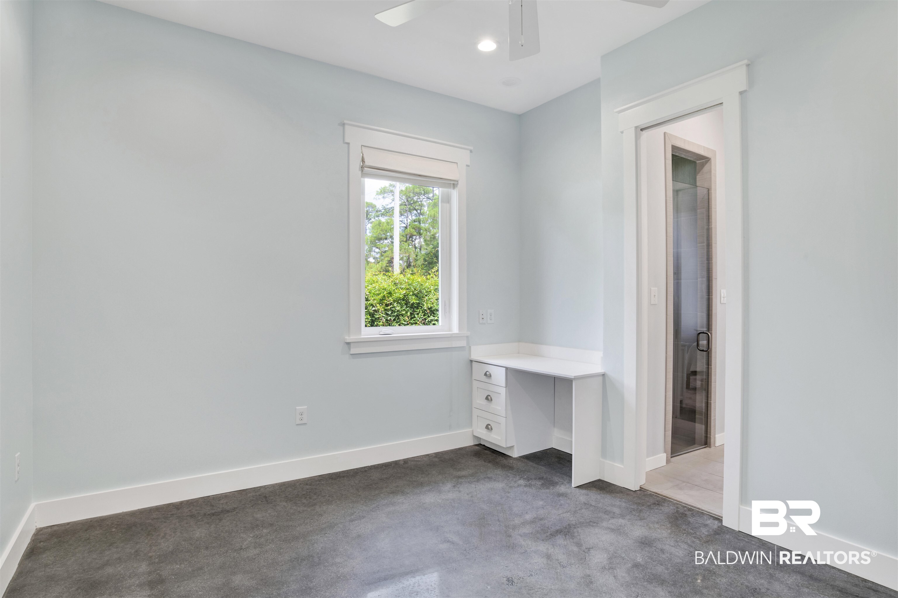 27980 Canal Road Orange Beach, AL 36561 - Photo 34 of 46 Unfurnished bedroom with concrete flooring, recessed lighting, a ceiling fan, and built in study area