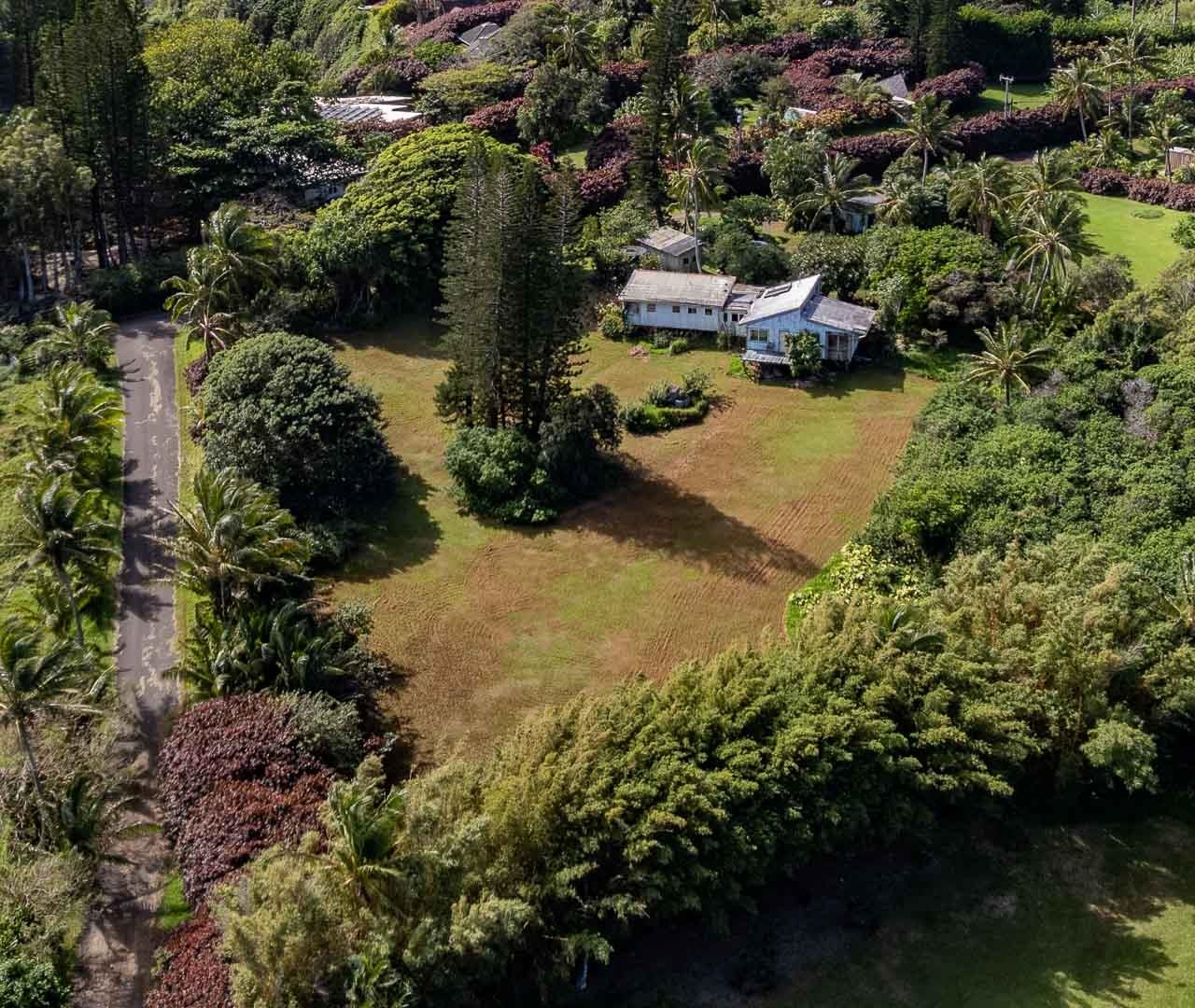 210 Door Of Faith Road Haiku, HI 96708 - Photo 12 of 44 an aerial view of residential houses with outdoor space and trees