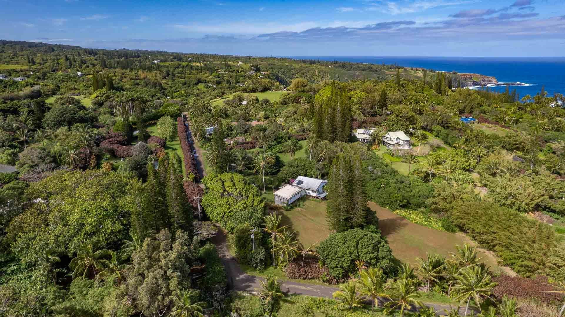 210 Door Of Faith Road Haiku, HI 96708 - Photo 16 of 44 a view of a houses with a yard