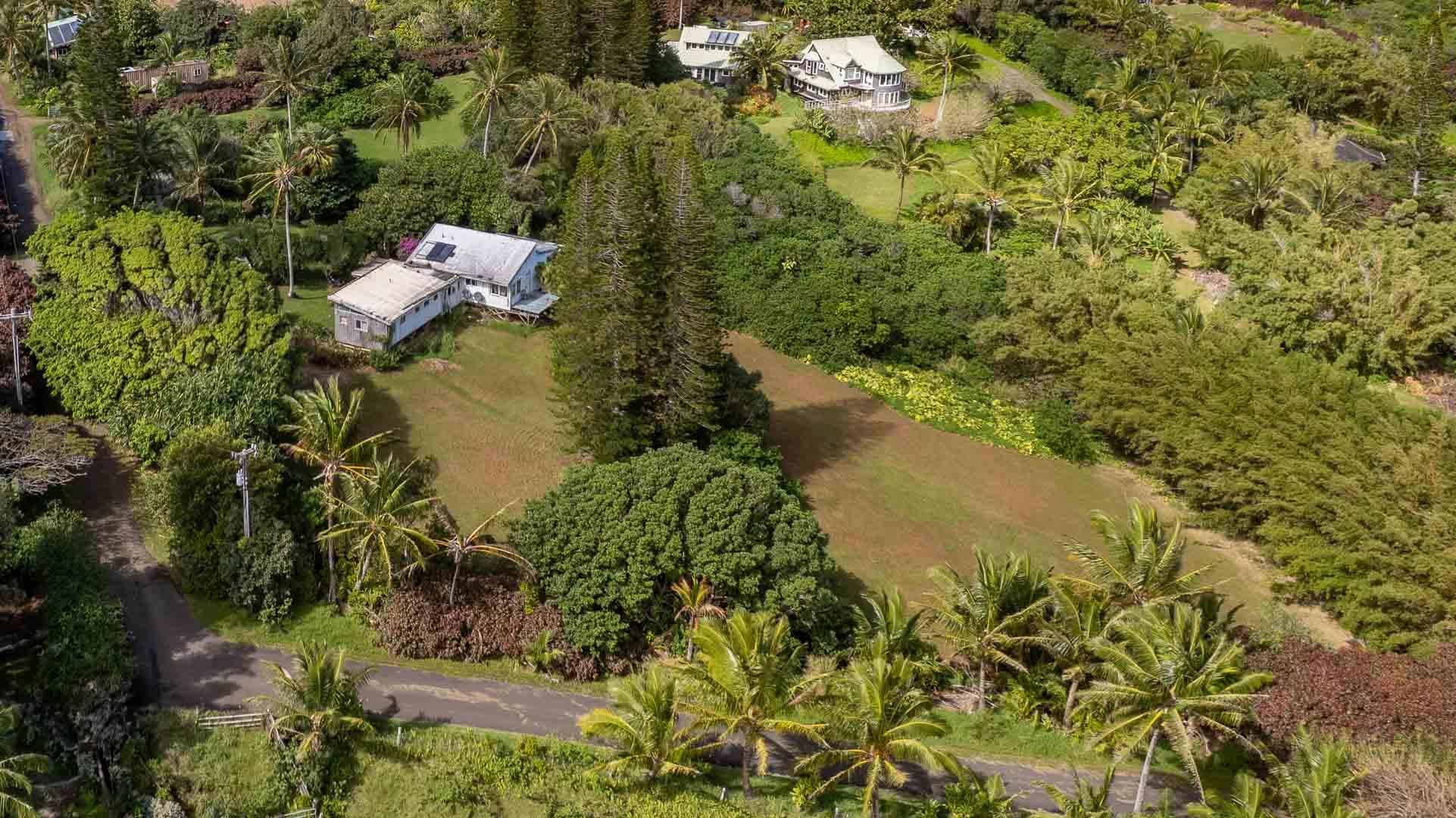 210 Door Of Faith Road Haiku, HI 96708 - Photo 17 of 44 a aerial view of a house with a yard