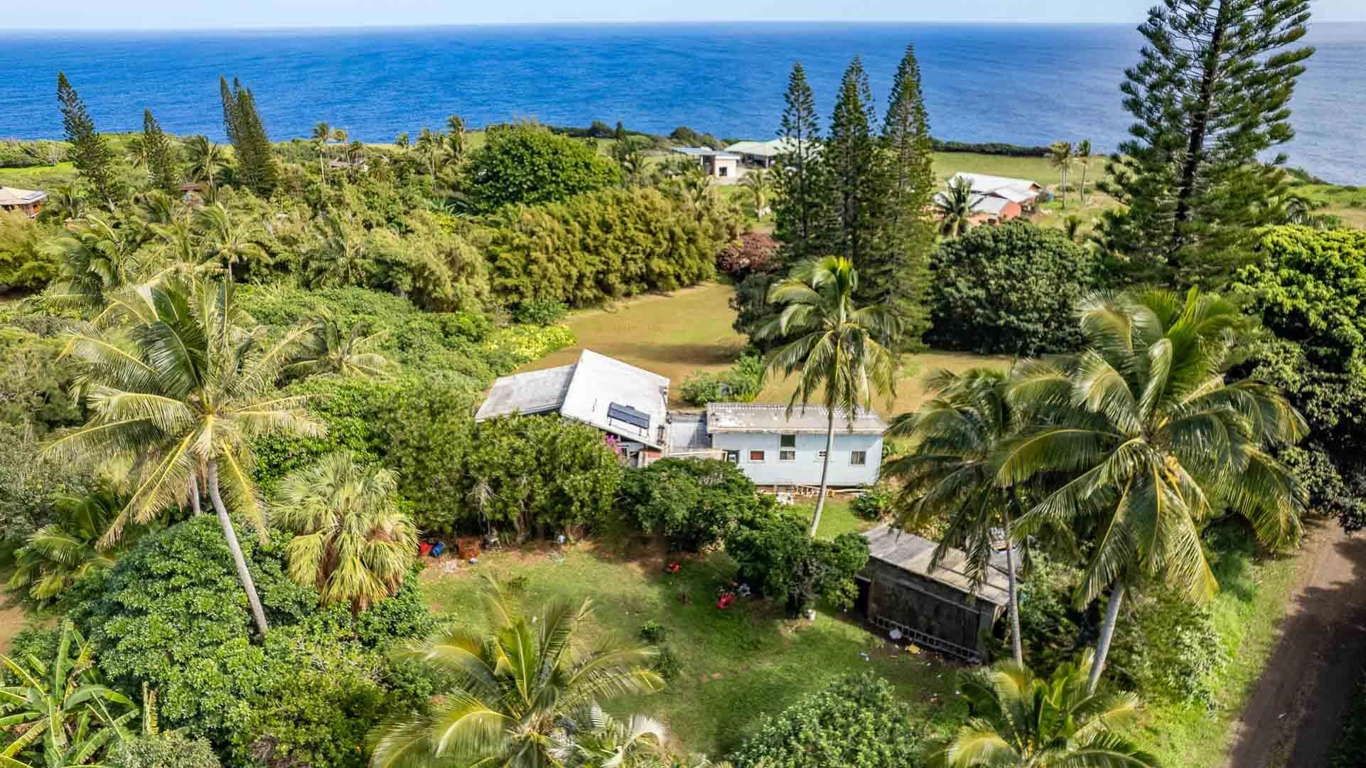 210 Door Of Faith Road Haiku, HI 96708 - Photo 23 of 44 a view of a houses with a yard