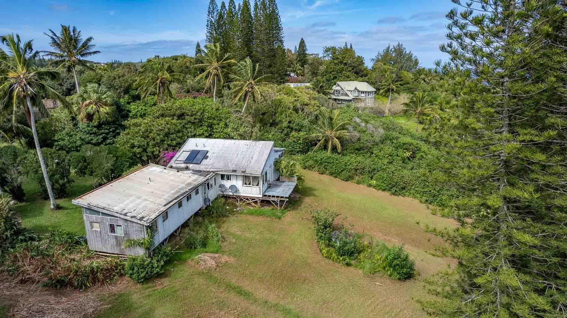 210 Door Of Faith Road Haiku, HI 96708 - Photo 26 of 44 an aerial view of a house with a yard basket ball court and outdoor seating