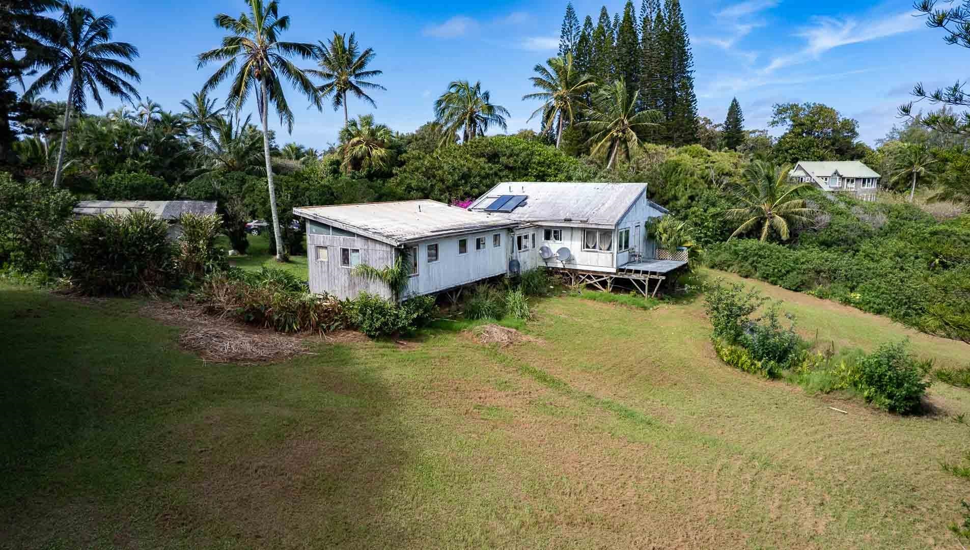 210 Door Of Faith Road Haiku, HI 96708 - Photo 28 of 44 a view of a house with pool and sitting area