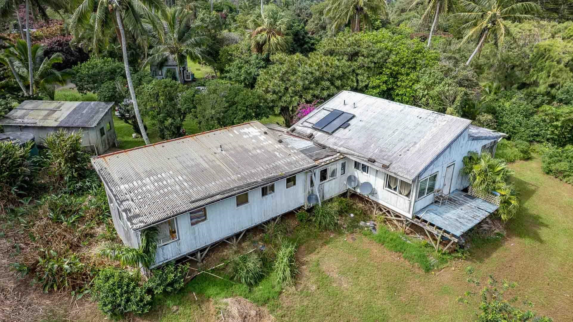 210 Door Of Faith Road Haiku, HI 96708 - Photo 34 of 44 an aerial view of a house with swimming pool and large trees