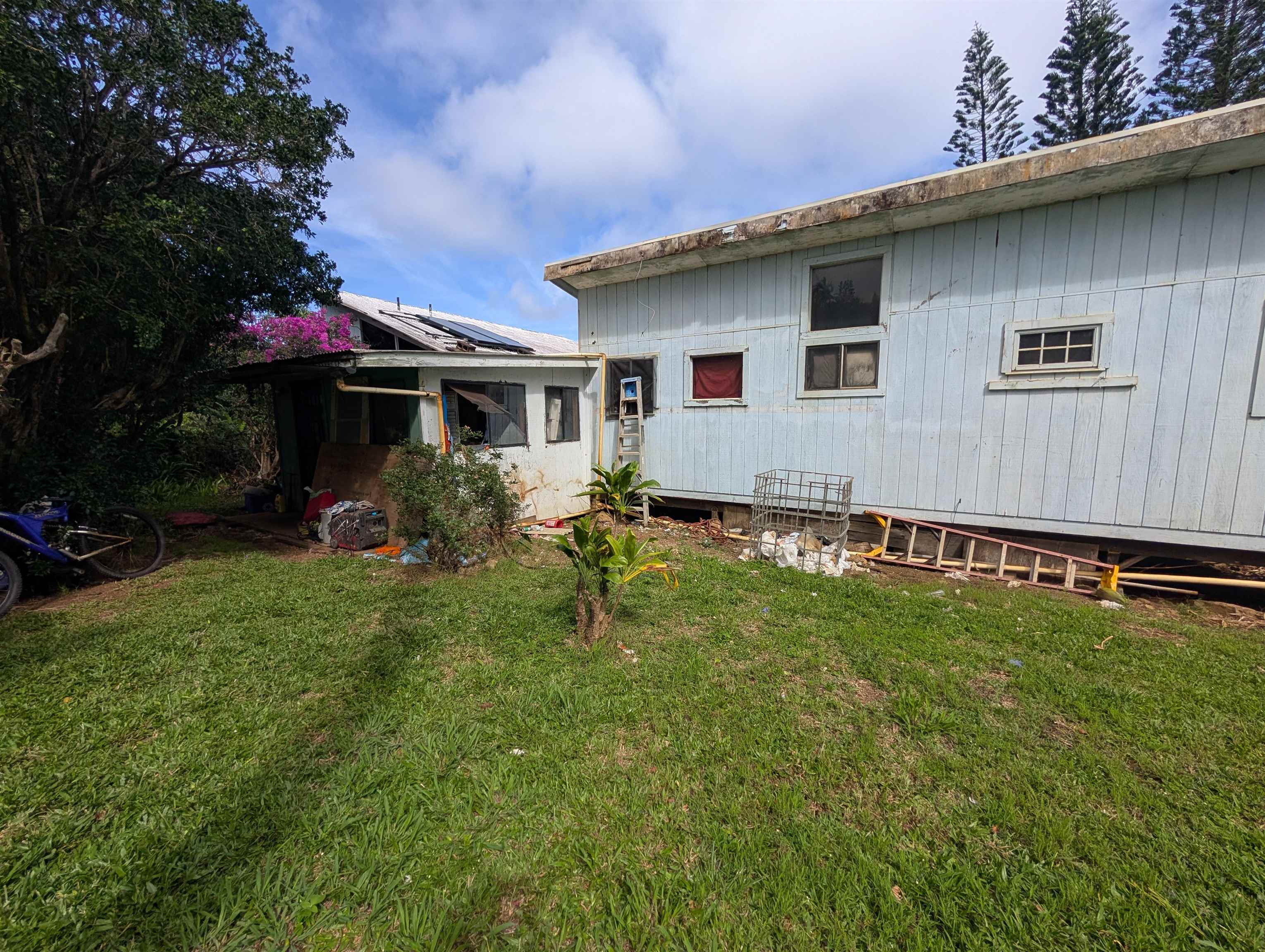 210 Door Of Faith Road Haiku, HI 96708 - Photo 40 of 44 a view of a house with backyard