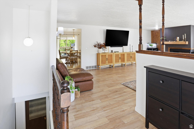 5108 South 2000th Street West Roy, UT 84067 - Photo 6 of 61 Living area with light wood-style floors