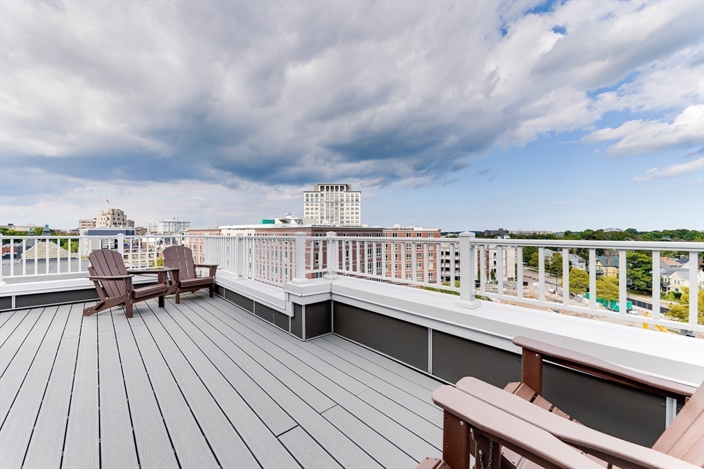 2 Cliveden Street, Unit 601E Quincy, MA 02169 - Photo 25 of 27 a roof deck with a table and chairs