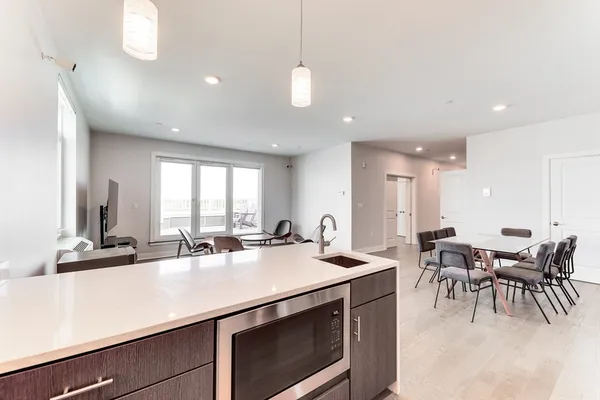 a kitchen with lots of counter top space and living room