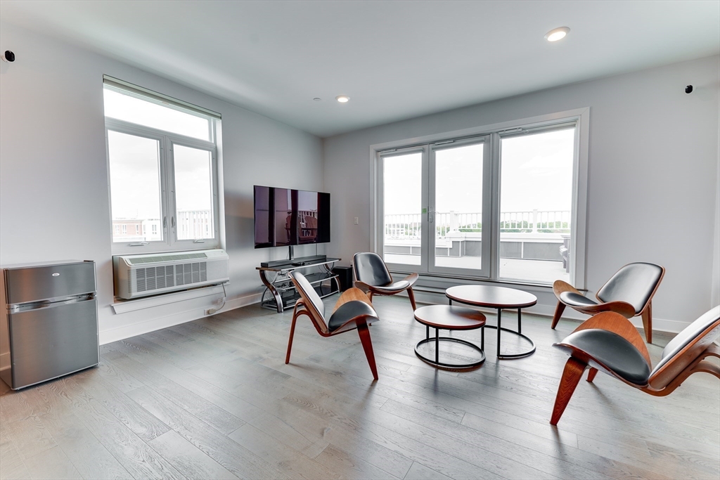 2 Cliveden Street, Unit 601E Quincy, MA 02169 - Photo 10 of 27 a living room with furniture and a window