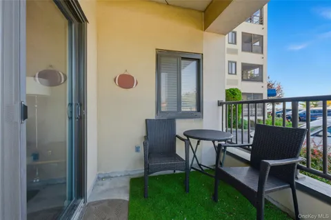 a view of a balcony with chairs