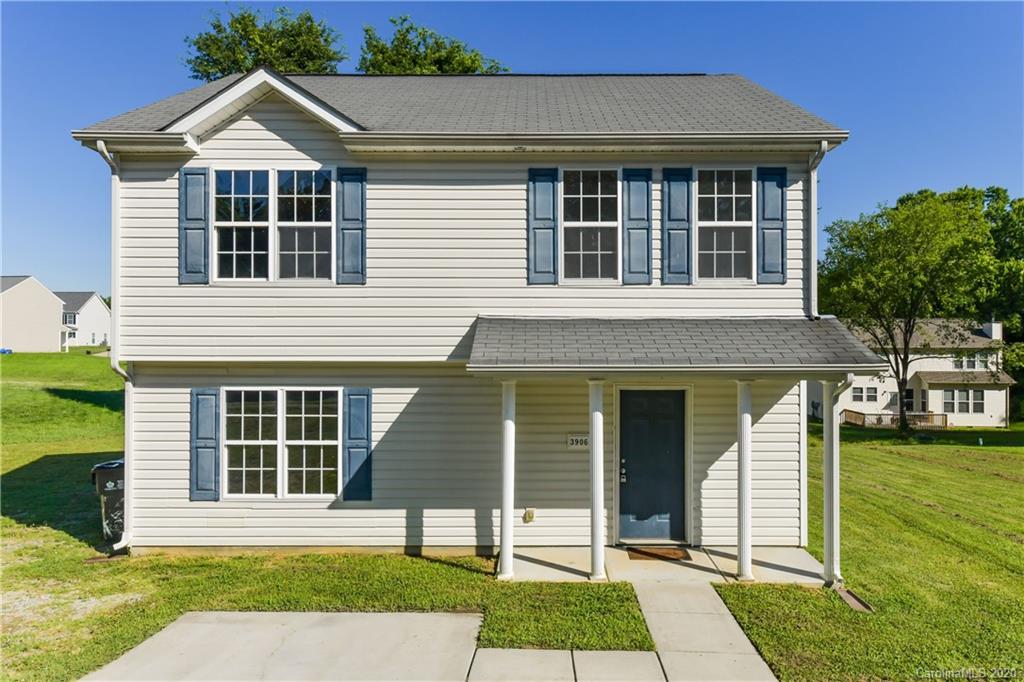 3906 Harris Houston Road Charlotte, NC 28262 - Photo 2 of 28 a front view of a house with a yard