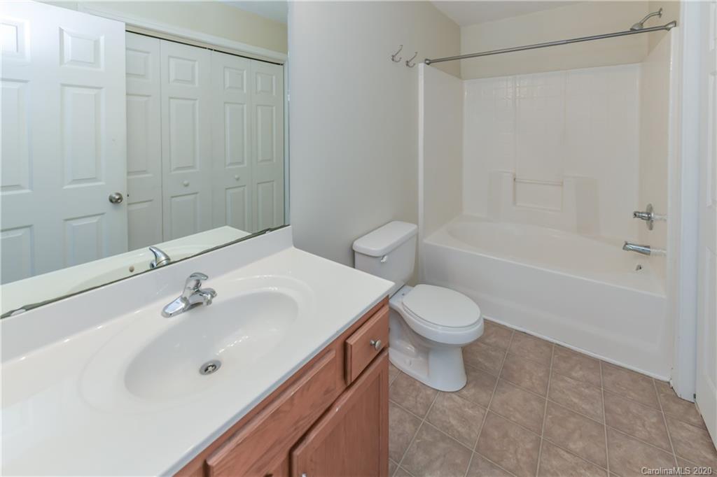 3906 Harris Houston Road Charlotte, NC 28262 - Photo 18 of 28 a bathroom with a sink a toilet and shower