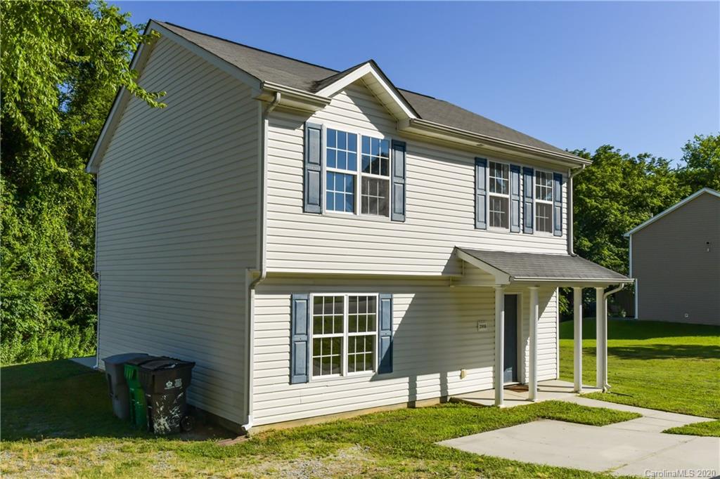 3906 Harris Houston Road Charlotte, NC 28262 - Photo 3 of 28 a front view of a house with a yard