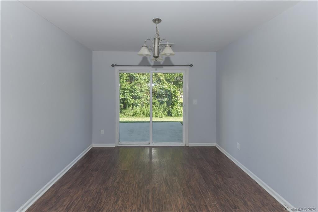 3906 Harris Houston Road Charlotte, NC 28262 - Photo 24 of 28 a view of empty room with wooden floor and fan