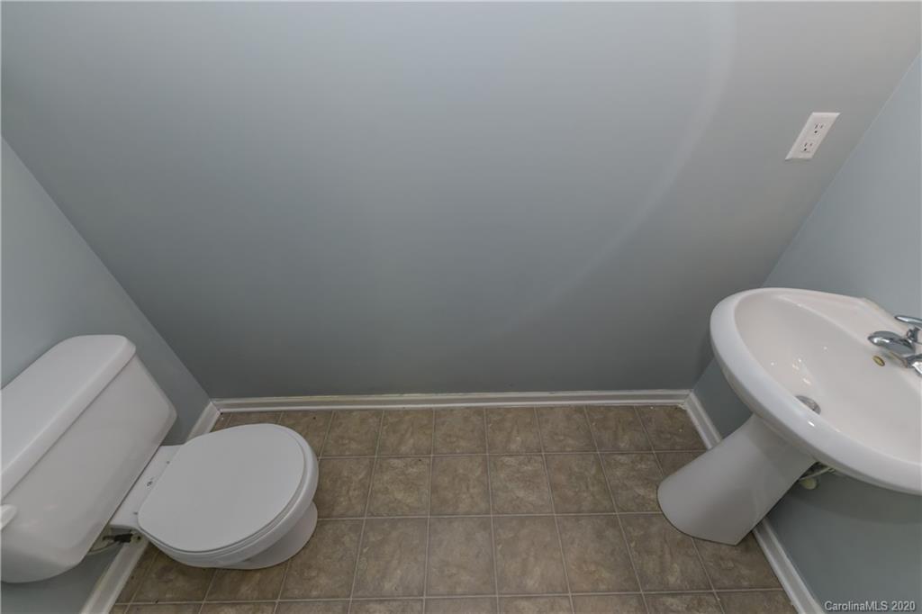 3906 Harris Houston Road Charlotte, NC 28262 - Photo 9 of 28 a bathroom with a toilet