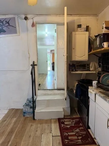 a kitchen with a sink and a stove top oven