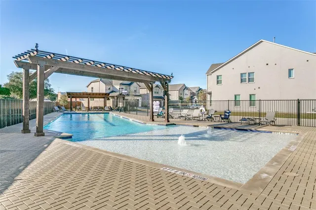 a view of swimming pool with outdoor seating