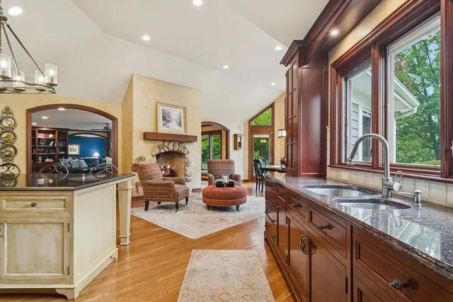 a kitchen with stainless steel appliances granite countertop a stove and a sink