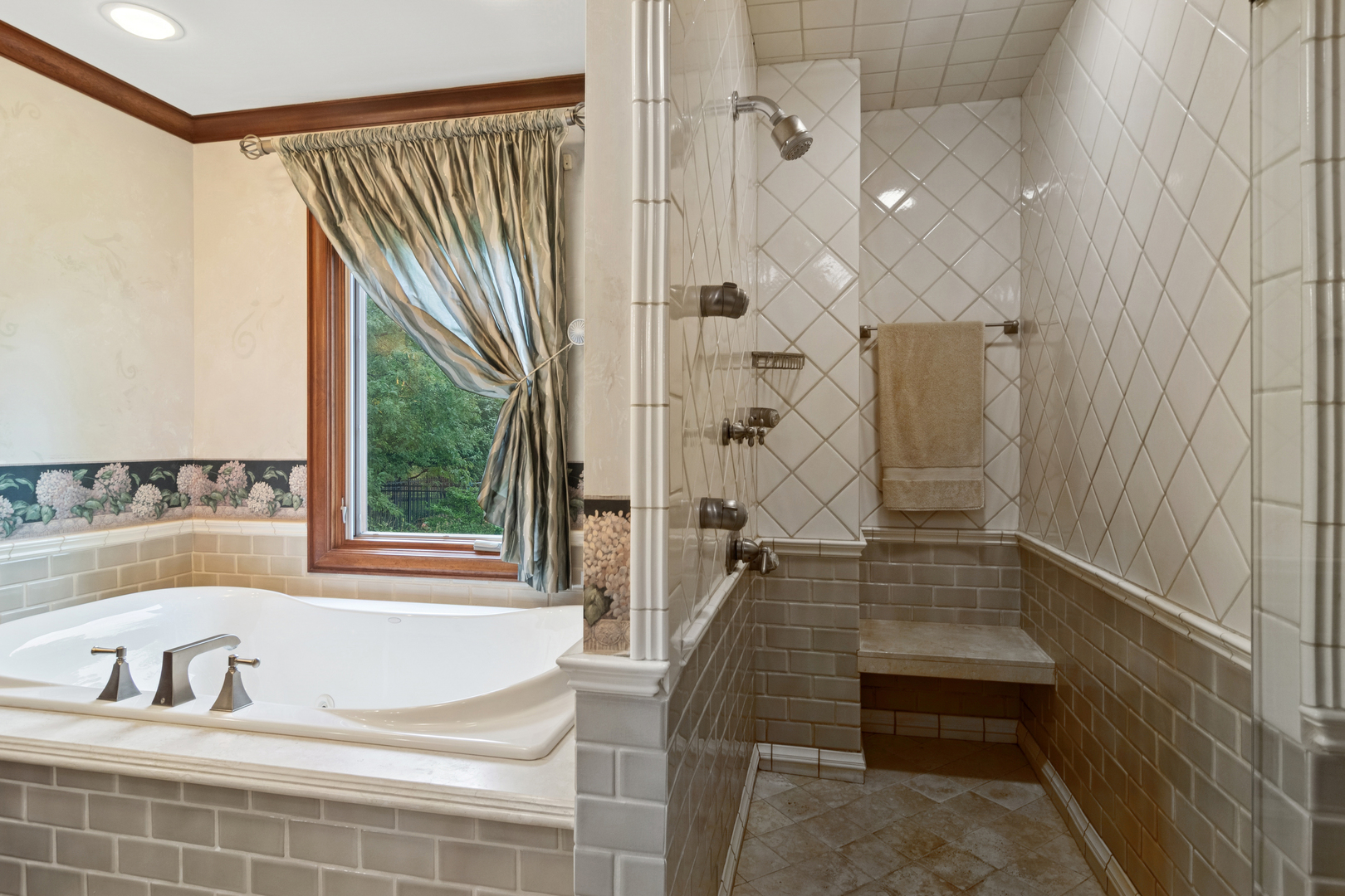 1987 Selkirk Court Inverness, IL 60010 - Photo 23 of 63 a bathroom with a bathtub and a shower