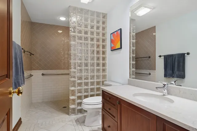 a hall with wooden floor and a sink