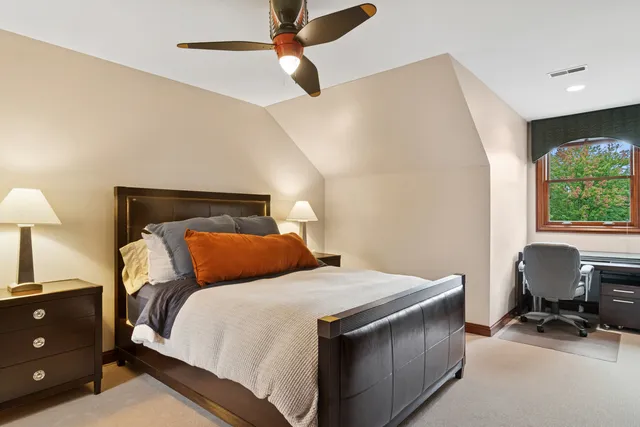 a living room with a table tennis table and a chandelier